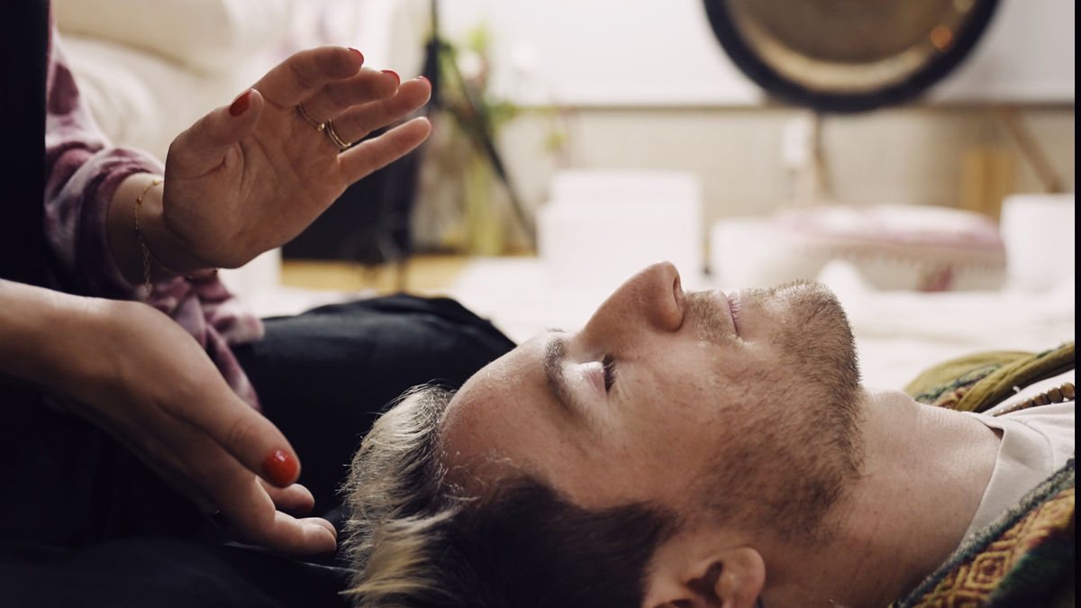 Experiencing the soothing benefits of Reiki post a Pilates session, showcasing the holistic approach to fitness at our West Hollywood Pilates studio