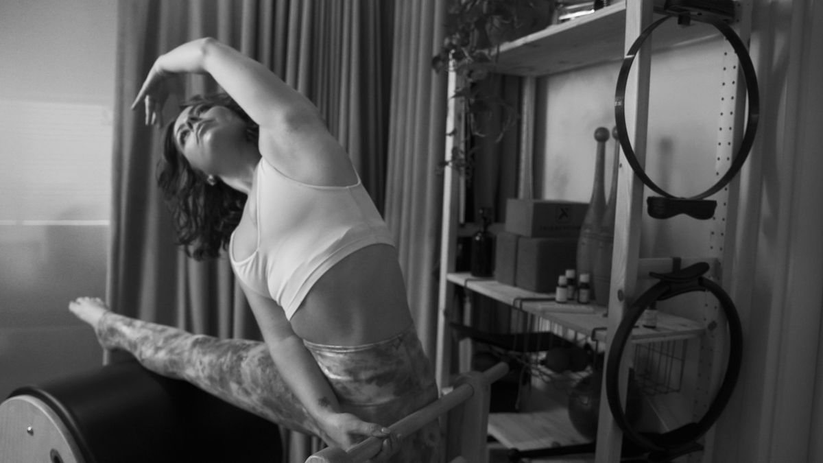 Unlock your body's potential at our Pilates studio in Los Angeles, founder, Jaime Elkayam, performing a challenging Contrology ladder barel routine