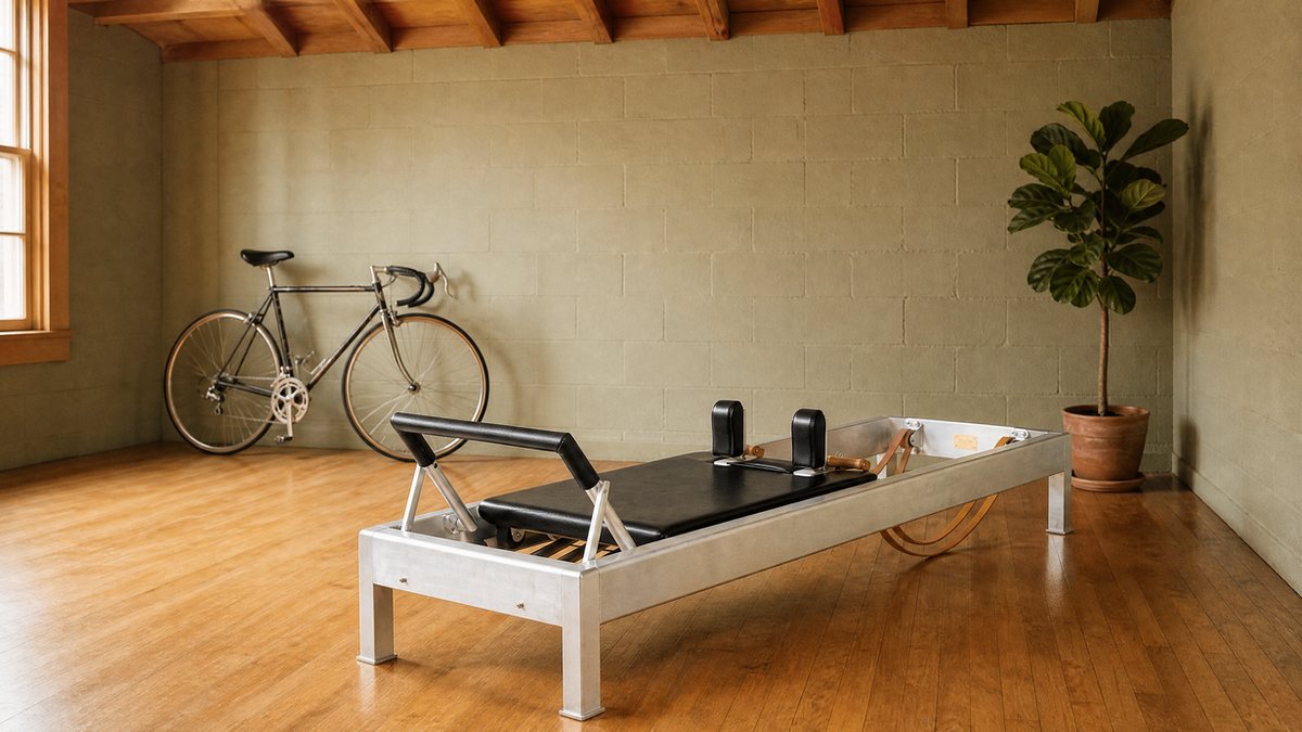 A classic road bicycle and an authentic classical Contrology Pilates reformer in a private West Hollywood Pilates studio in Los Angeles