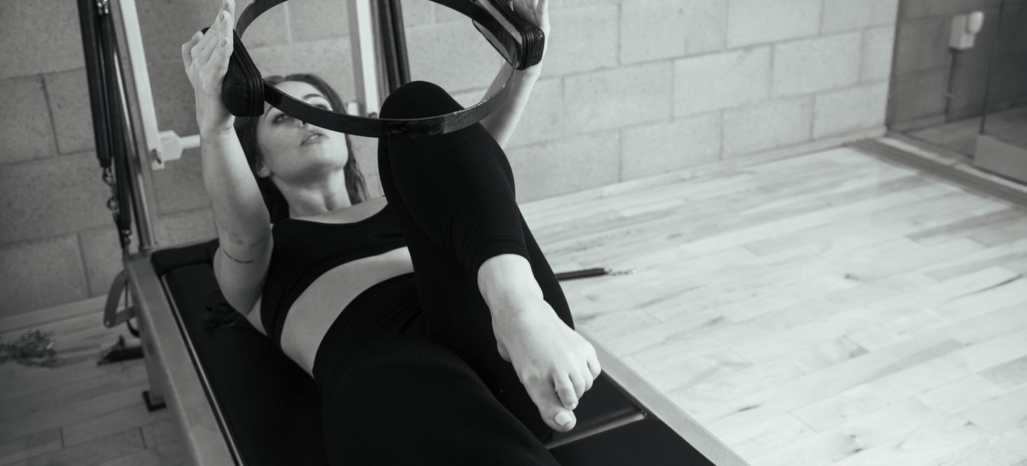A client on the reformer during an intro session at West Hollywood Pilates